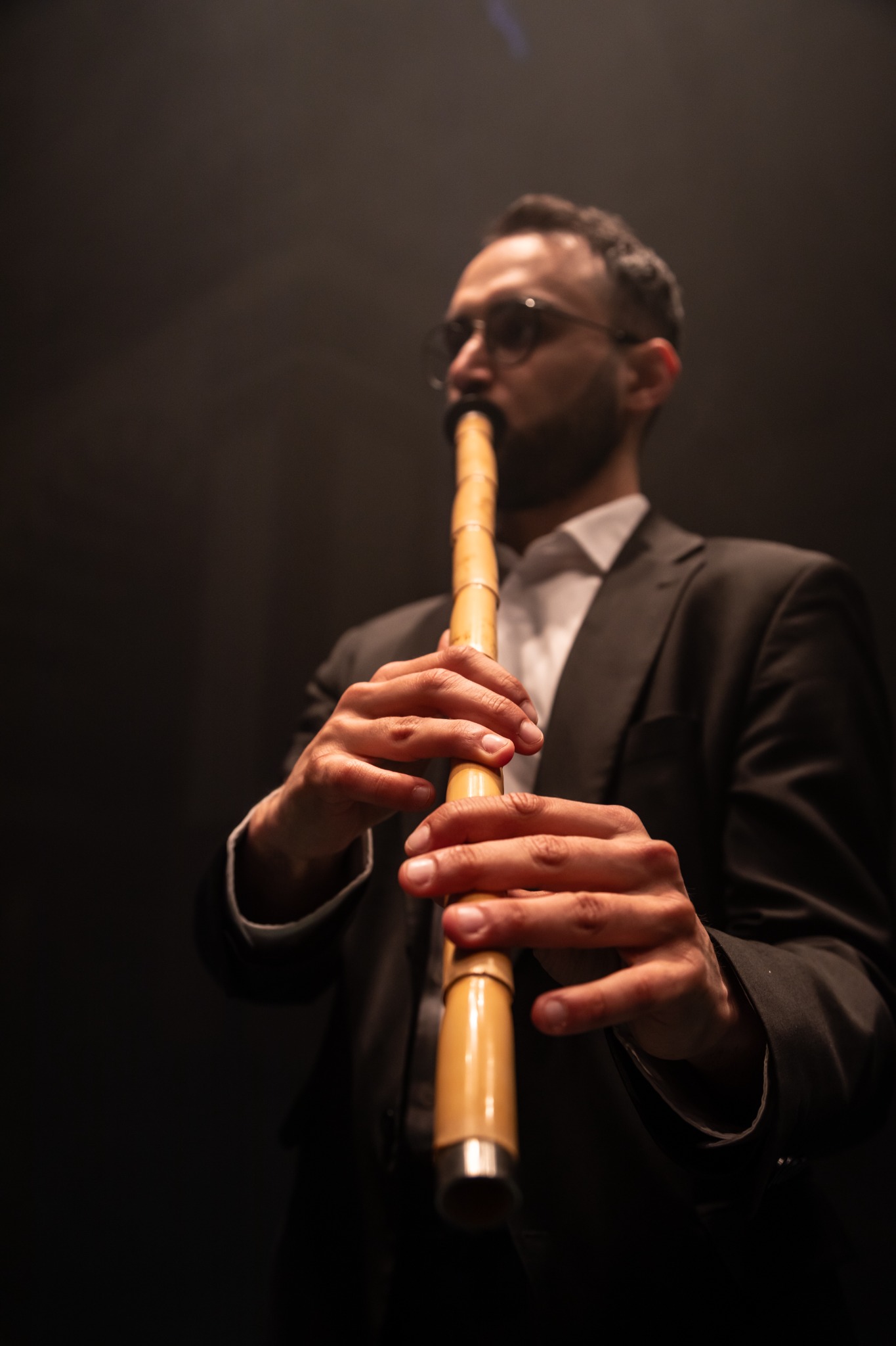Close-up of Şükrü Kirtiş playing the ney